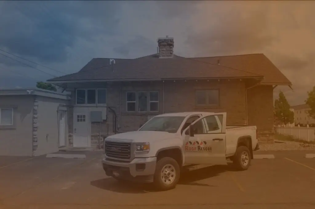 roof-rescue-car-in-front-of-a-house