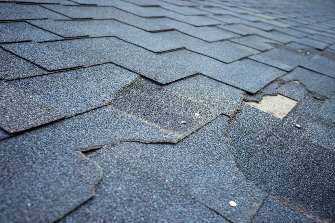 -Roofing inspection Broken shingle