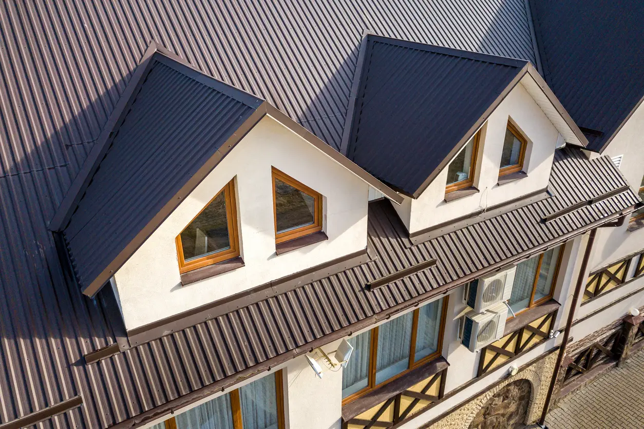 Metal roofing for homes - An aerial view of a residential property featuring a metal roof.