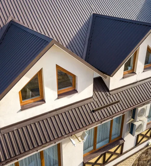 Metal roofing for homes - An aerial view of a residential property featuring a metal roof.